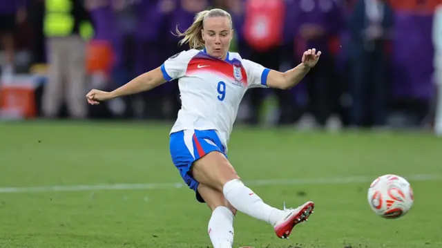 Beth Mead of England slips as she takes a penalty