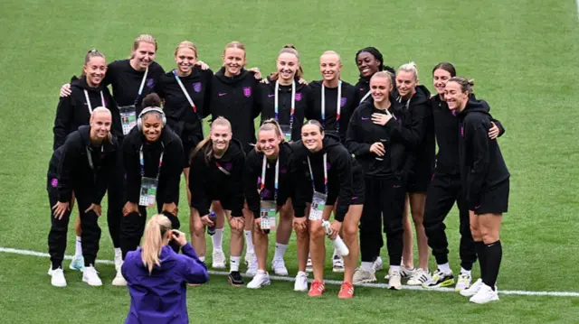 Players of England pose for a photo during a pitch inspection