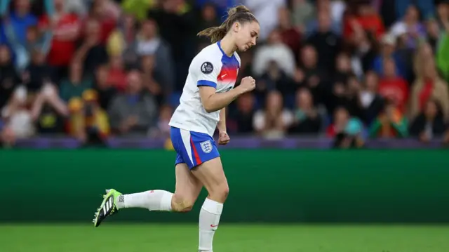 Niamh Charles of England celebrates scoring the team's third penalty