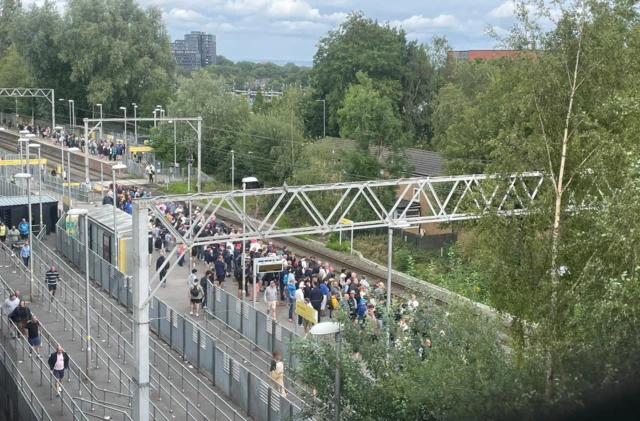 Fans queue at Old Trafford tram stop