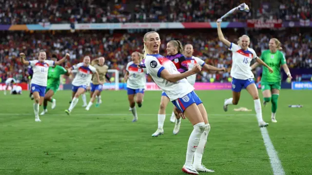 Chloe Kelly of England celebrates scoring the team's winning penalty in the penalty shoot