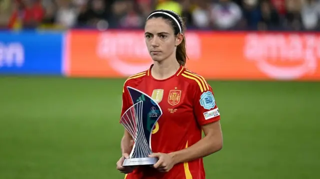Spain's midfielder #06 Aitana Bonmati holds the trophy after winning Best Player of the Tournament Award after Spain lost to England