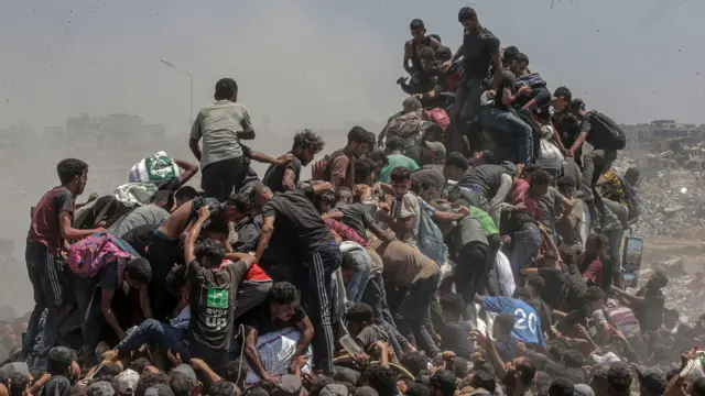 Gazans climb on aid truck