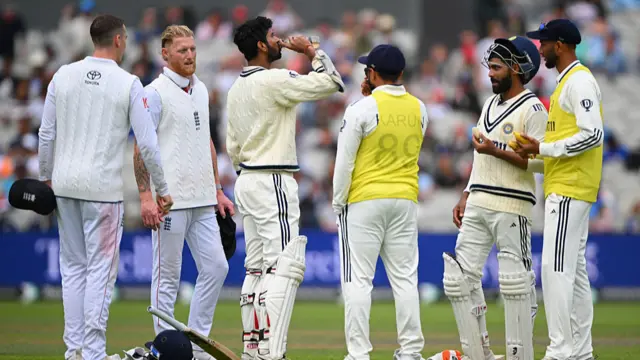 England fielders talking to India batters