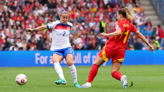 England's Lucy Bronze in action with Spain's Alexia Putellas