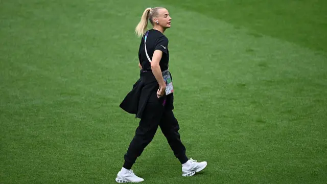 Chloe Kelly of England looks on during a pitch inspection prior to the UEFA Women's EURO 2025 Final match between England and Spain at St. Jakob-Park