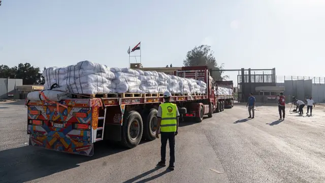 Trucks carrying aid enter Gaza through the Rafah border crossing