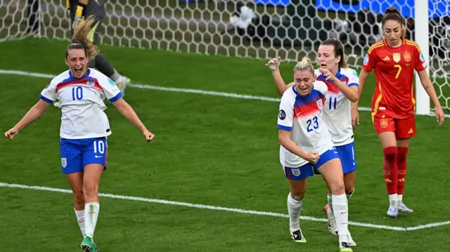 England's midfielder #10 Ella Toone, England's forward #23 Alessia Russo, England's forward #11 Lauren Hemp celebrate after Russo scored an equalizer,