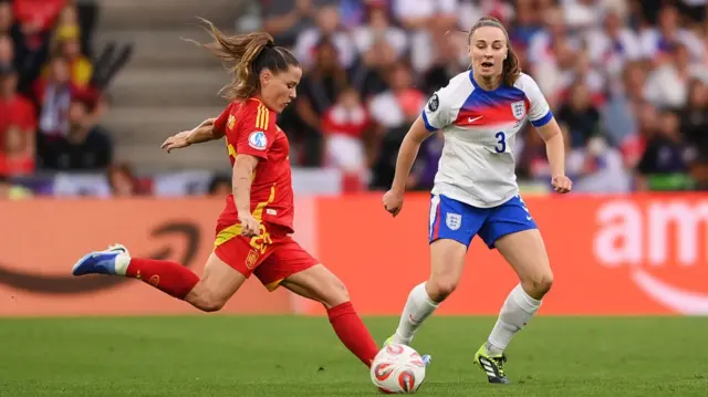 Claudia Pina of Spain shoots whilst under pressure from Niamh Charles of England