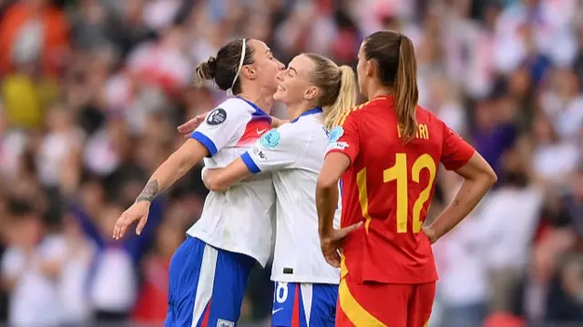 Chloe Kelly of England celebrates with teammate Lucy Bronze after assisting Alessia Russo