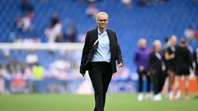 England's Dutch coach Sarina Wiegman looks on as she walks on the pitch ahead of the UEFA Women's Euro 2025 final football match between England and Spain at the St. Jakob-Park Stadium in Basel,
