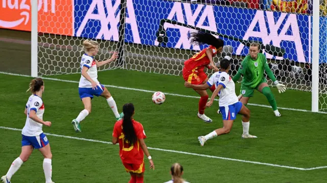 Spain's forward #18 Salma Paralluelo (3rd R) fails to score past England's goalkeeper #01 Hannah Hampton (R