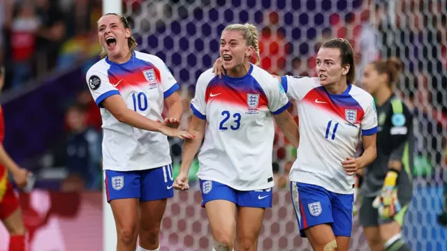 Alessia Russo of England celebrates scoring her team's first goal with teammates Ella Toone and Lauren Hemp