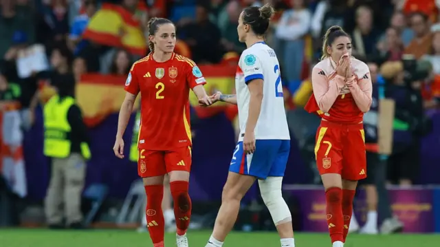 Ona Batlle of Spain greets Lucy Bronze of England following her side's defeat