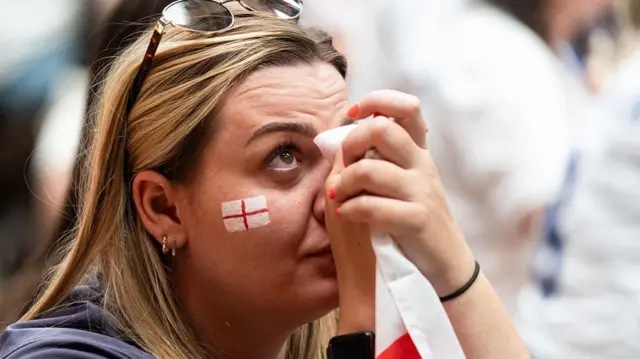 England fans react as they watch a live broadcast