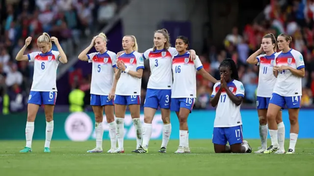 Players of England react during the penalty shoot out