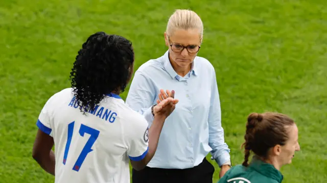 England's Michelle Agyemang shakes hands with England manager Sarina Wiegman before she comes on as a substitute