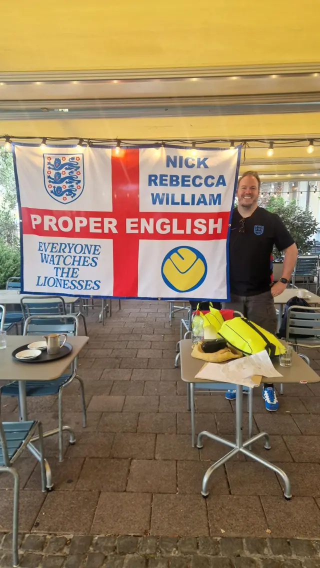 England fan Nick Jones with a St George's flag reading "Proper English"