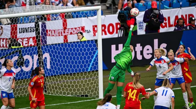 England's goalkeeper #01 Hannah Hampton deflects the ball