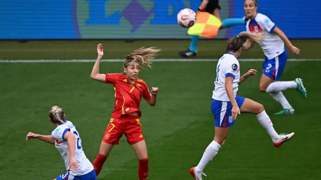 Spain's defender #07 Olga Carmona (2ndL) goes for a header during the UEFA Women's Euro 2025 final football match between England and Spain at the St. Jakob-Park Stadium in Basel,