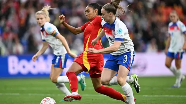 Spain's forward #18 Salma Paralluelo and England's defender #03 Niamh Charles fight for the ball