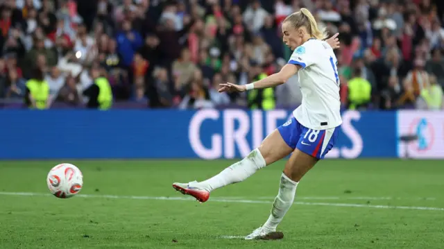 Chloe Kelly of England scores the team's winning penalty in the penalty shoot