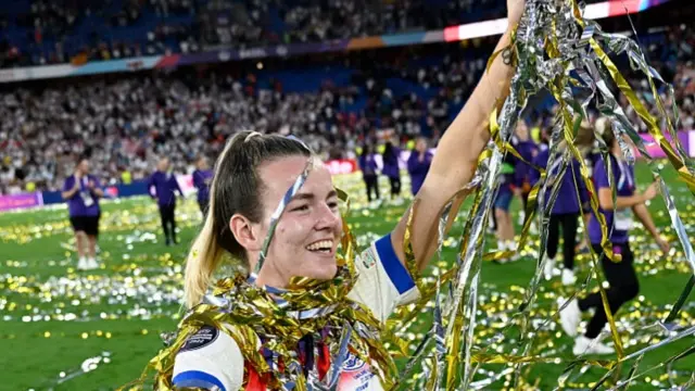 Lauren Hemp of England celebrates winning