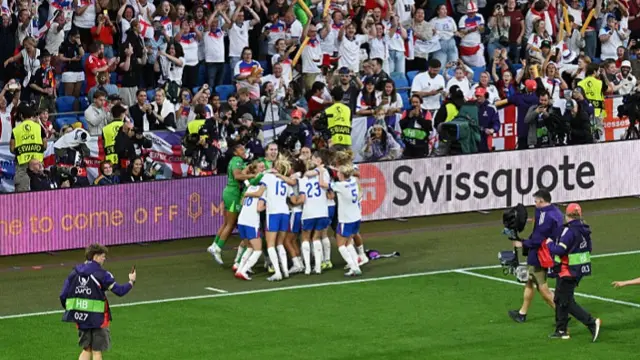 Chloe Kelly of England celebrates scoring the team's winning penalty in the penalty shoot
