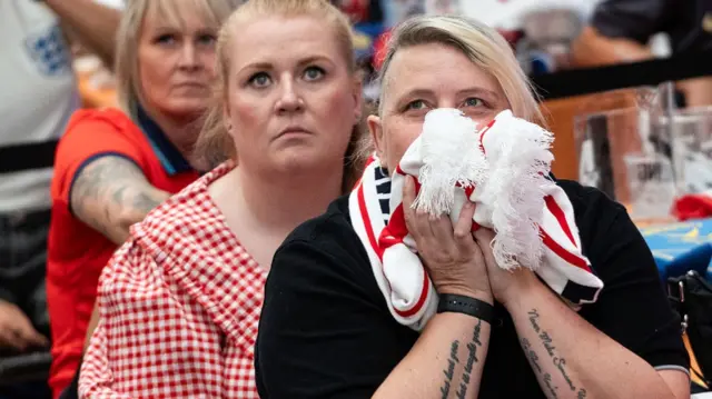 England fans react as they watch a live broadcast