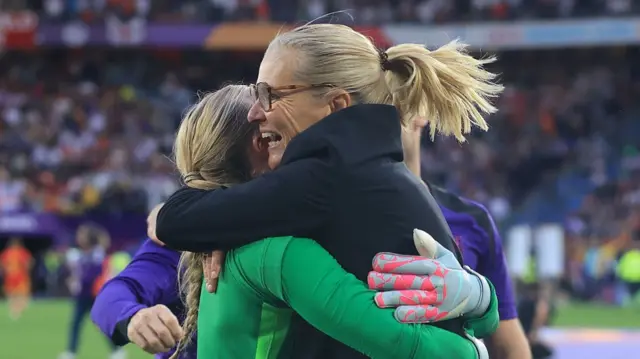 England Head Coach/Manager Sarina Wiegman celebrates with Hannah Hampton