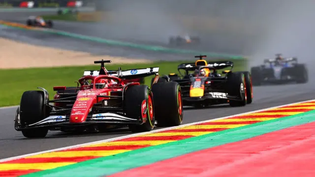 Charles Leclerc leads Max Verstappen at Spa.