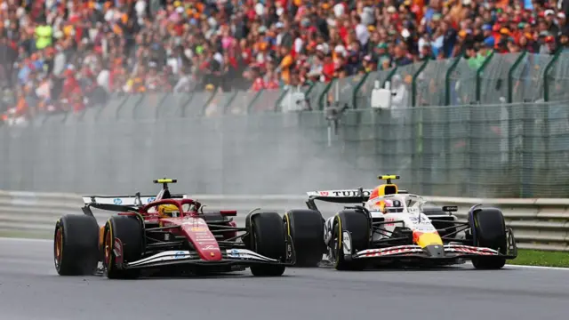 Lewis Hamilton overtakes Liam Lawson at Spa.