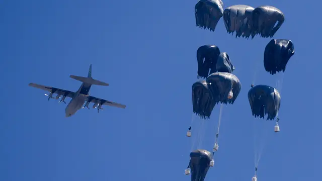 A plane drops aid over Gaza
