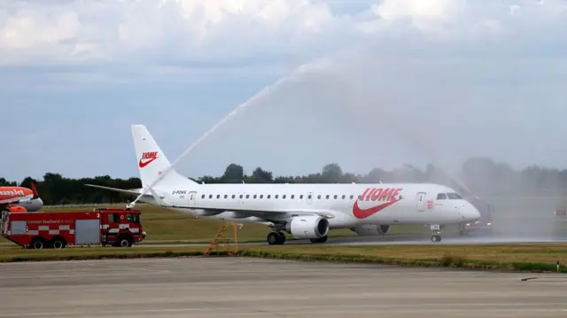 The plane carrying the England Women Squad are given a welcome