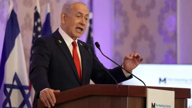 Netanyahu speaks at a lectern