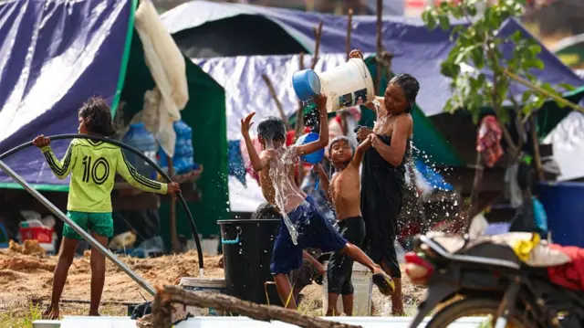 Cambodian families hunkering down a refugee camp housing more than 27,000 people, after fleeing from the Choam Ksant district near Thai-Cambodian border