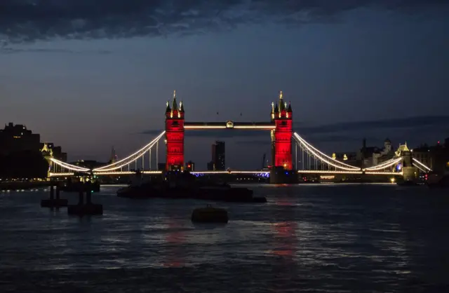 An image of Tower Bridge lit up red and white after England's Euro 2025 win