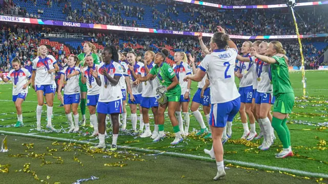 England players celebrate their trophy win