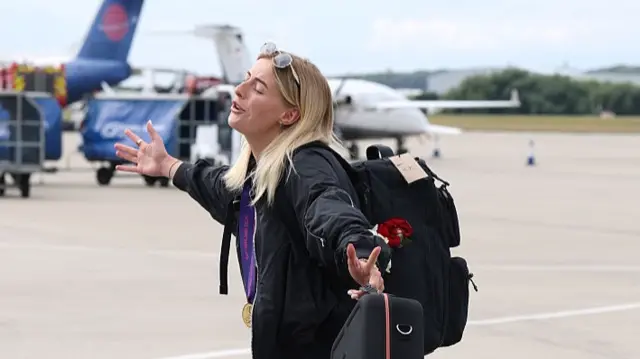 Chloe Kelly of England arrives at Southend Airport following the team's victory