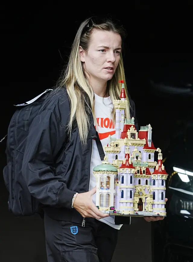 England's Lauren Hemp holding a Lego set based on the Disney movie 'Beauty and the Beast'