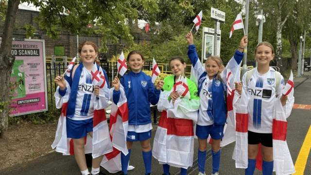 A group of England fans heading to the parade