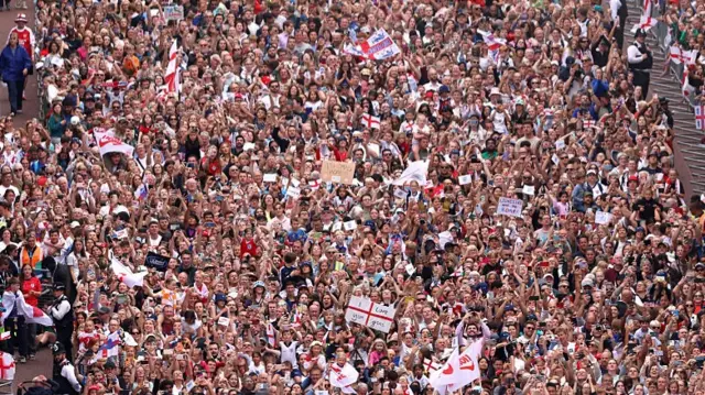 A general view of fans as they gather to watch the England Women's team victory parade and celebration