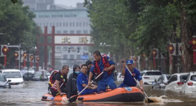 Floods have forced people in Beijing to flee on rubber boats