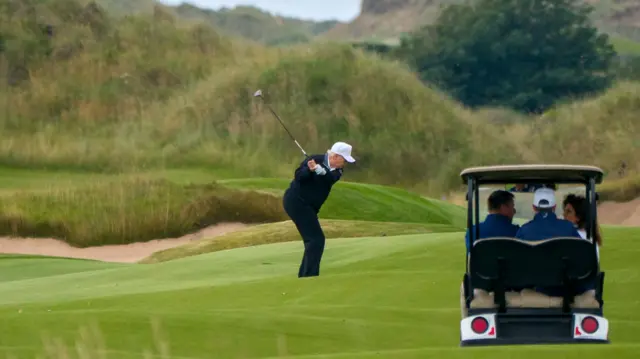 President Donald Trump on the first hole of the New Course, the second championship course at Trump International Golf Links, on the Menie Estate in Balmedie, Aberdeenshire.
