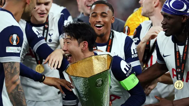 Son Heung-Min of Tottenham Hotspur is seen with the trophy after his team defeat Manchester United during the UEFA Europa League Final 2025 between Tottenham Hotspur and Manchester United