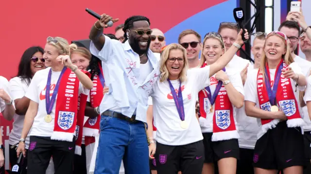 England manager Sarina Wiegman (centre right) and Burna Boy during a Homecoming Victory Parade