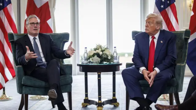 Starmer and Trump sitting at a meeting at the Trump Turnberry gold resort