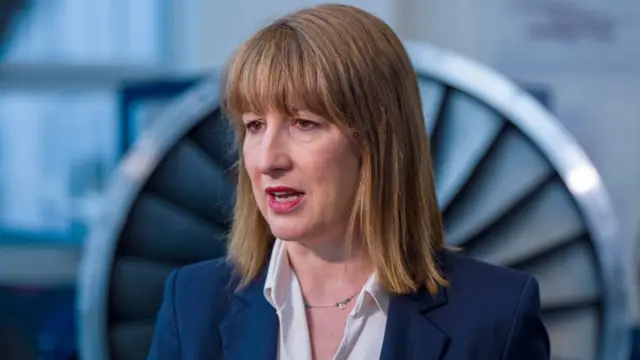 Rachel Reeves is seen in closeup, she has a neutral expression on her face.