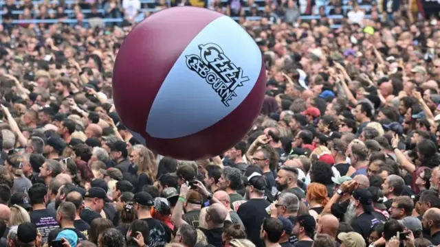 A beach-ball bounces over the head of crowds of concert-goers at the gig