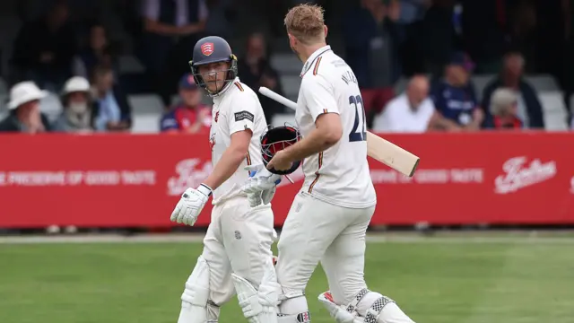 Tom Westley and Paul Walter walk off for lunch